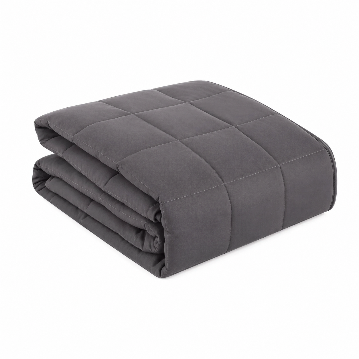 CalmWeight grey weighted blanket folded on a bed